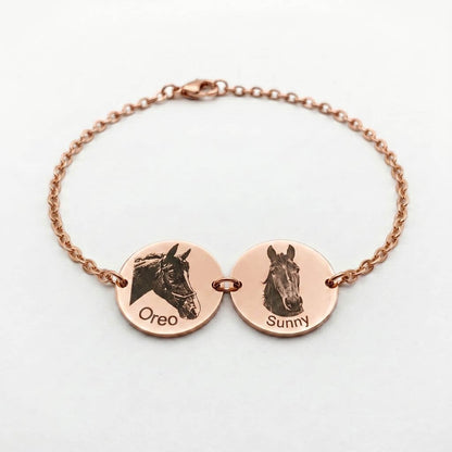 Rose gold bracelet with engraved horse faces and names on a white background